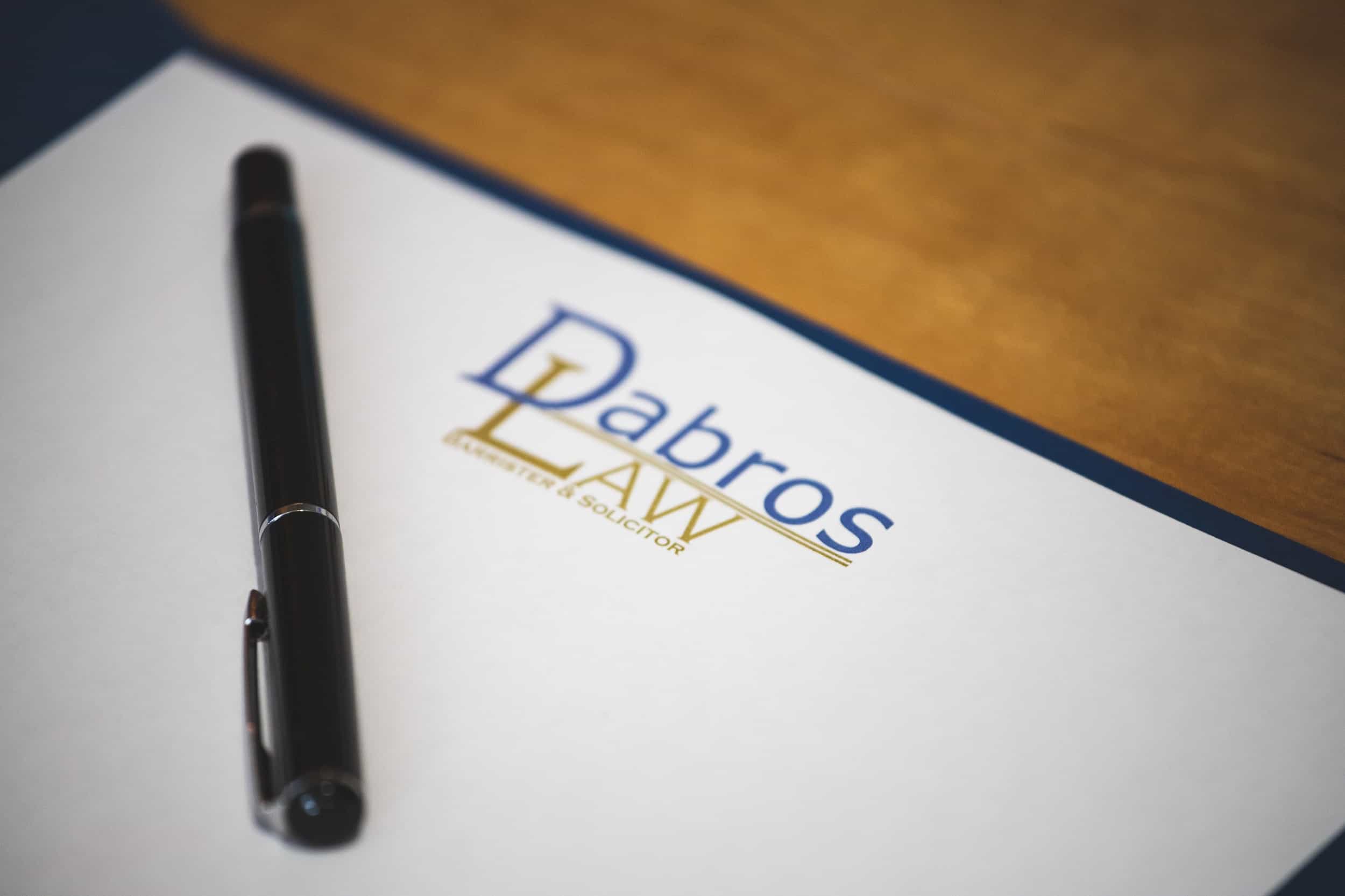 Dabros Law pen sitting on Dabros Law folder